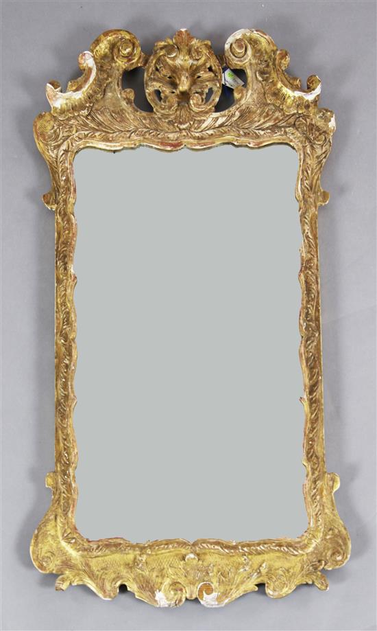 A George II carved giltwood and gesso wall mirror H. 3ft 2in. W.1ft 9in.